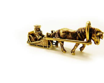 horse and sleigh figurine