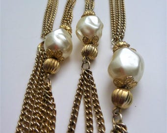 Faux pearl flapper necklace. long multi strand faux pearl necklace. waist length necklace