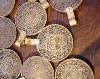 Tarnished Moroccan 50 franc coin with brass bail or loop