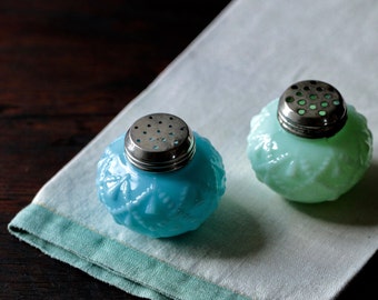 Pair of Consolidated Glass salt and pepper shakers.