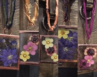 Beautiful pressed flowers displayed in miniture copper glass hanging frame.Wall hanging decor. Dried flowers. Display frame. Glass frame.