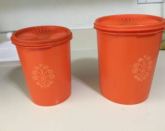 Vintage Tupperware canisters with gold design on front