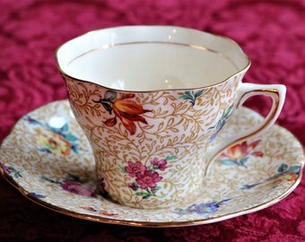 Floral Chintz with Bright Flowers, Tan Background, Gold Accents - Rosina Bone China Tea Cup and Saucer
