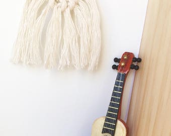 Modern dollhouse miniature guitar