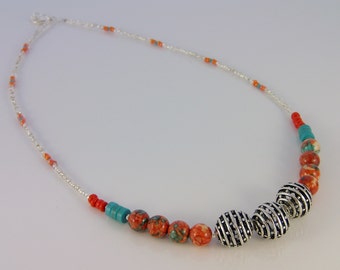 Hand beaded necklace in coral, turquoise, and silver