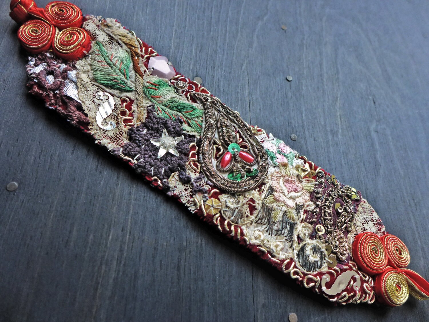 Textile wrist cuff bracelet with antique fabric trims