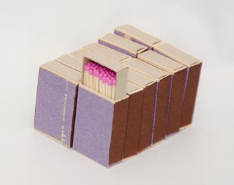 Twelve matchboxes, wooden matches with pink tips inside, striker from two sides, hanpacked item