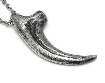 Fierce African Lion replica Claw pendant in silver clay.