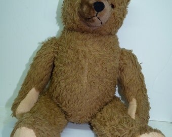 old teddy bear with moving arms and legs