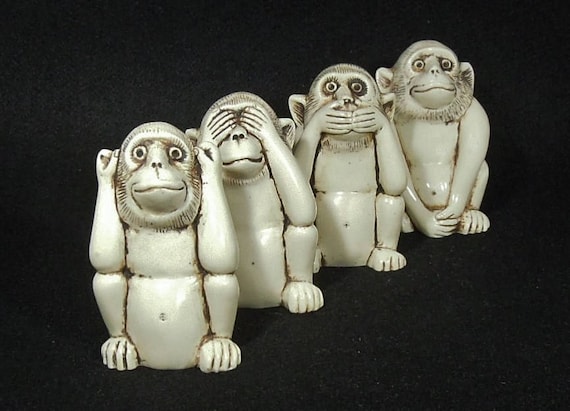 Four monkeys that hear no evil see no evil speak no evil do no