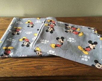 Mickey Mouse flannel receiving blanket and 2 matching burp cloths.
