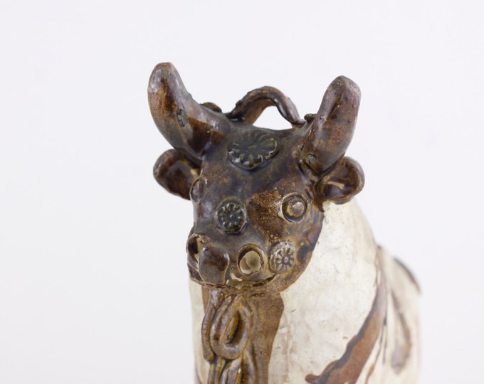 Handcrafted ceramic Bull, statue figurine of a stylized bull, Pucara Peruvian Andean traditional folklore myth storytelling
