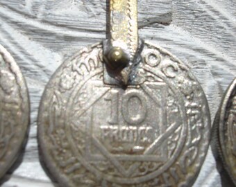 Moroccan 10 franc tarnished coin with gold colour loop or bail