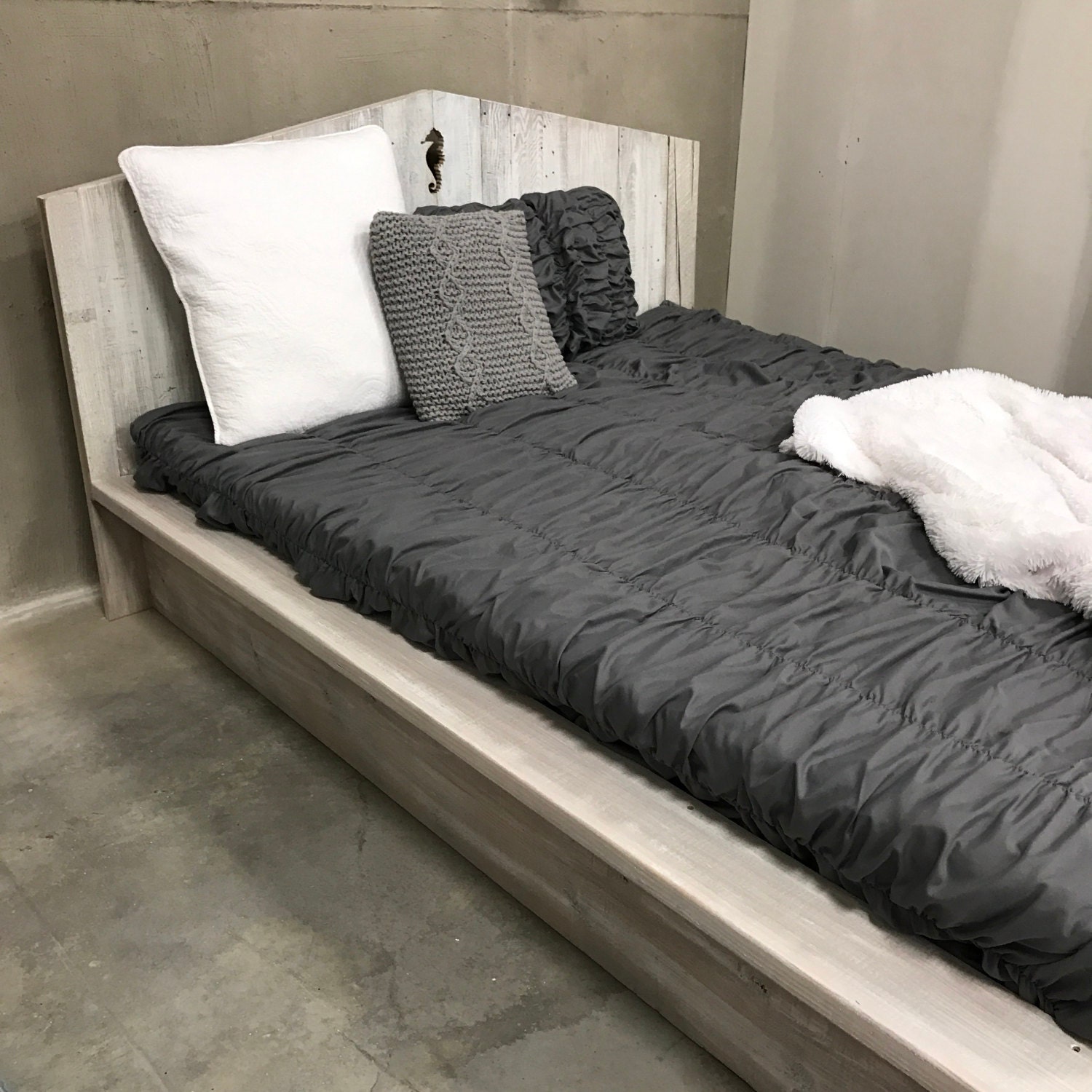 The Ash sun bleached driftwood finished platform bed with