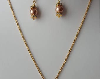 Collier perles Swarovski. Boucles d'oreilles perles Swarovski. Acier inoxydable plaqué Or
