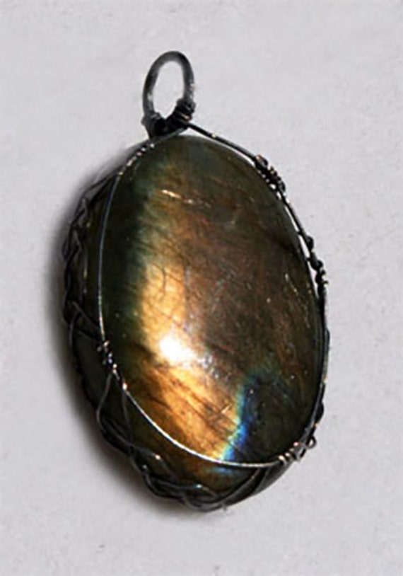 Labradorite pendant wrapped Celtic style in oxidized sterling silver