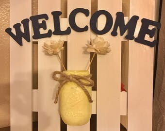 Picket fence welcome sign