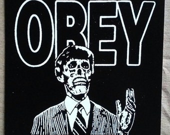They Live T Shirt we sleep obey sunglasses roddy piper