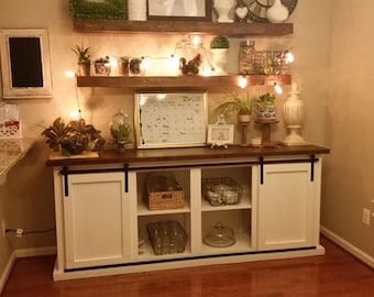 Handcrafted buffet table with exposed sliding door hardware.