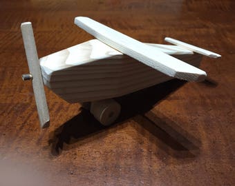 Toy plane made of spruce wood