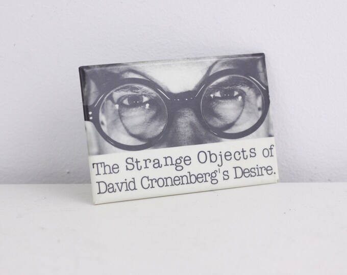 Vintage pin-back art button - the strange objects of david cronenberg's desire - film maker, artist 1993 exhibition, TIFF