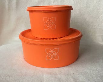 Set of two orange tupperware cake drums/containers with lids