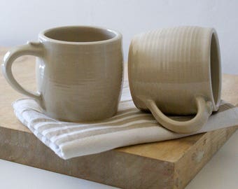 Two tankard style stoneware pottery tea mugs - glazed in simply clay