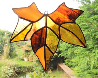 Stained glass maple leaf in browns/oranges