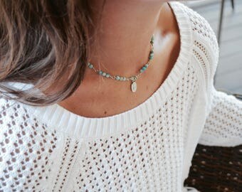 blue beaded chain with mini miraculous medal