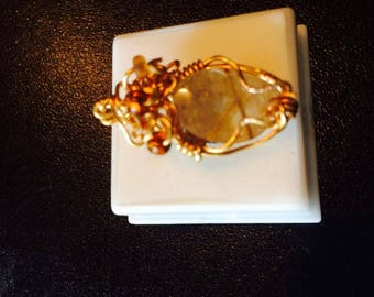 quartz with gold spears in the stone pendant