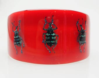 Large bright red lucite bracelet with real exotic beetles