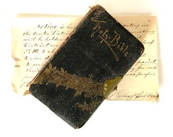 Antique Bible leather covered, embossed with a brass clasp