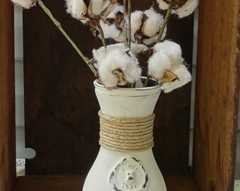Antique glass milk bottle with cotton bolls, chalk painted, distressed, and wound with twine.