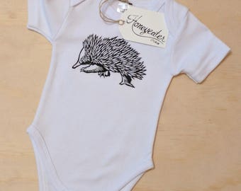 Hand printed, baby onesie – “Echidna”