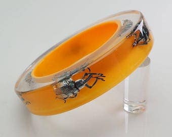 Huge yellow lucite bangle with real exotic insects