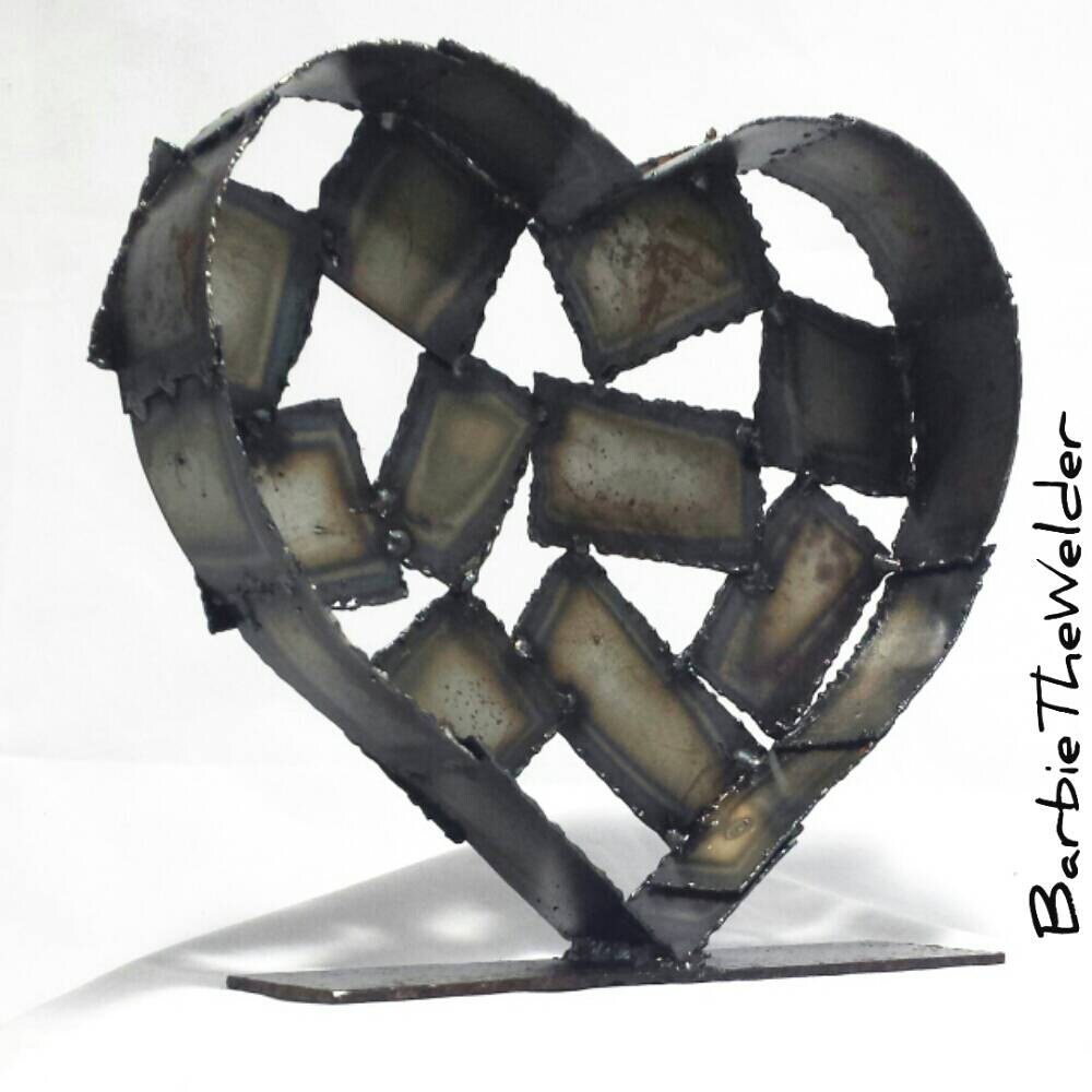 Mended heart shaped fine art sculpture welded metal patchwork