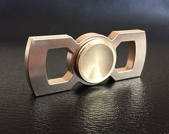Rotobow - brass hand spinner