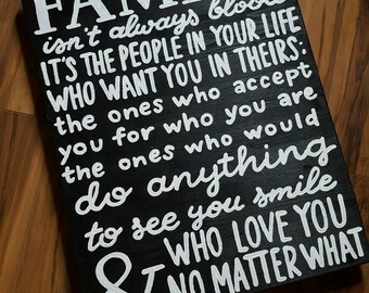 Family isn't always blood wood sign