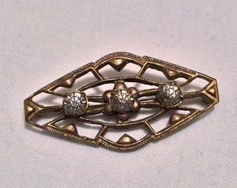 Lovely vintage metalwork and paste rhinestone brooch