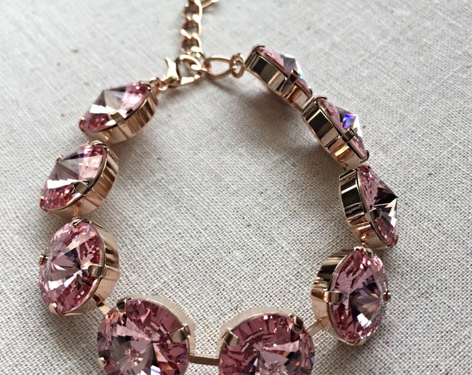 Stunning instant glamour romantic elegance pink genuine Swarovski crystal large stone bracelet in rose gold. 14 mm rivoli crystal stones.