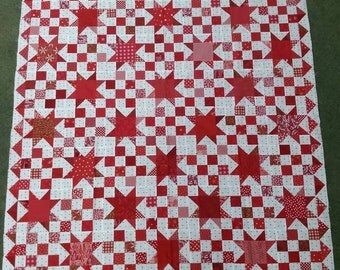 Red and white star quilt top