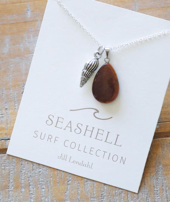 Items similar to Seashell Charm & Gem Pendant Necklace on Etsy