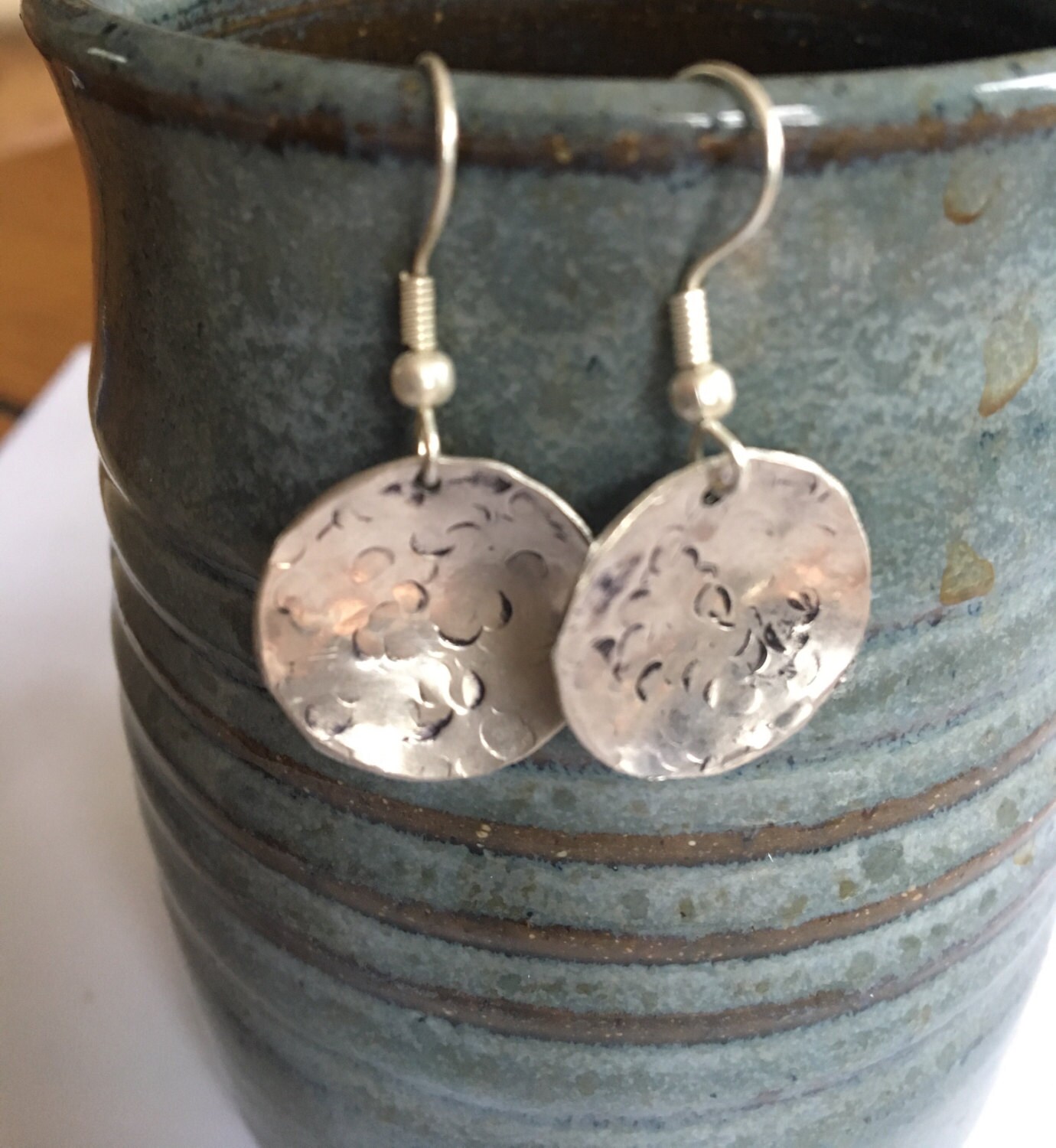 Nickel dangle earrings hand cut and stamped metal work just