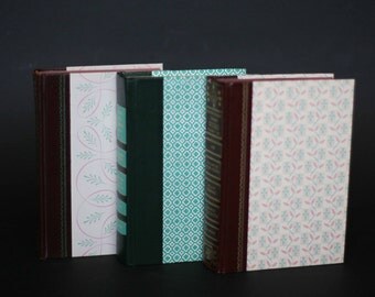 vintage readers digest condensed books with graphic covers in teal and pink set of three