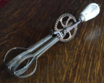 vintage nmetal with wood handle hand whisk