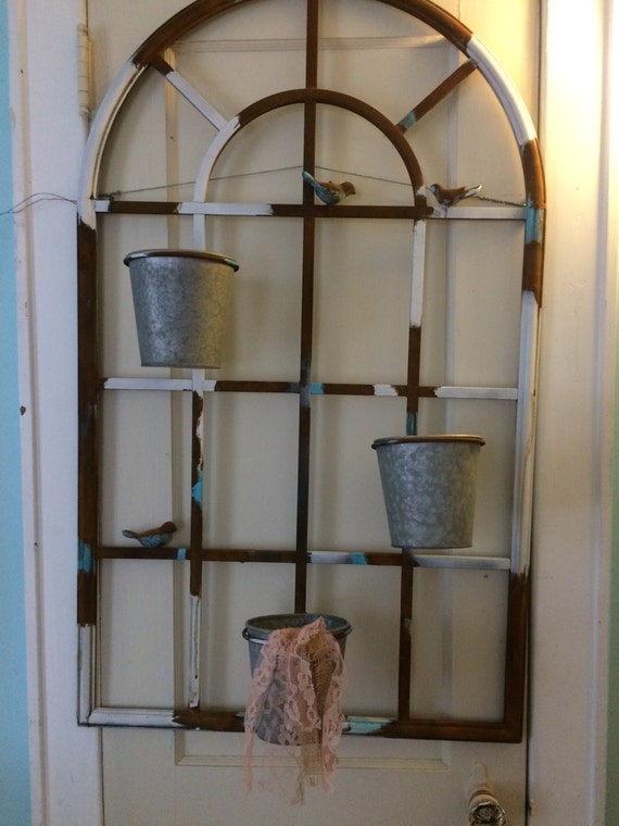 XL Wrought iron arched rusty window with potted floral