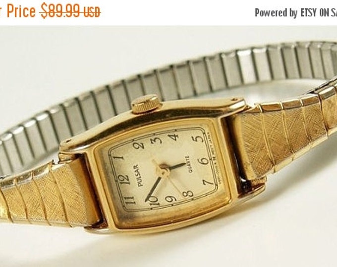 Storewide 25% Off SALE Lovely Vintage Ladies Pulsar Quartz Gold Tone Watch Featuring Cream Colored Bezel and Brushed Gold Flex Band