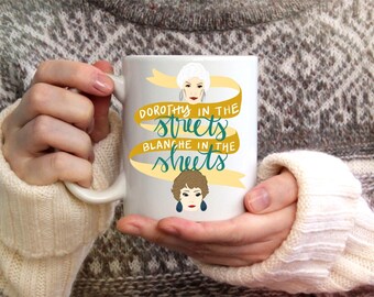 The Golden Girls Dorothy in the Streets Blanche Devereaux in the Sheets Funny Coffee Mug Drink Cup