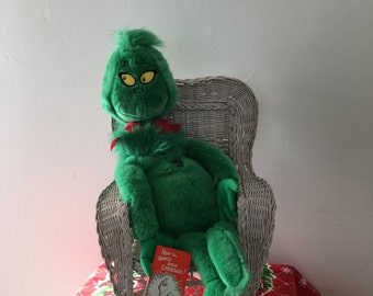 grinch stuffed animal and book