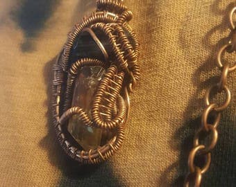 Wire woven black tourmaline and yellow apatite pendant